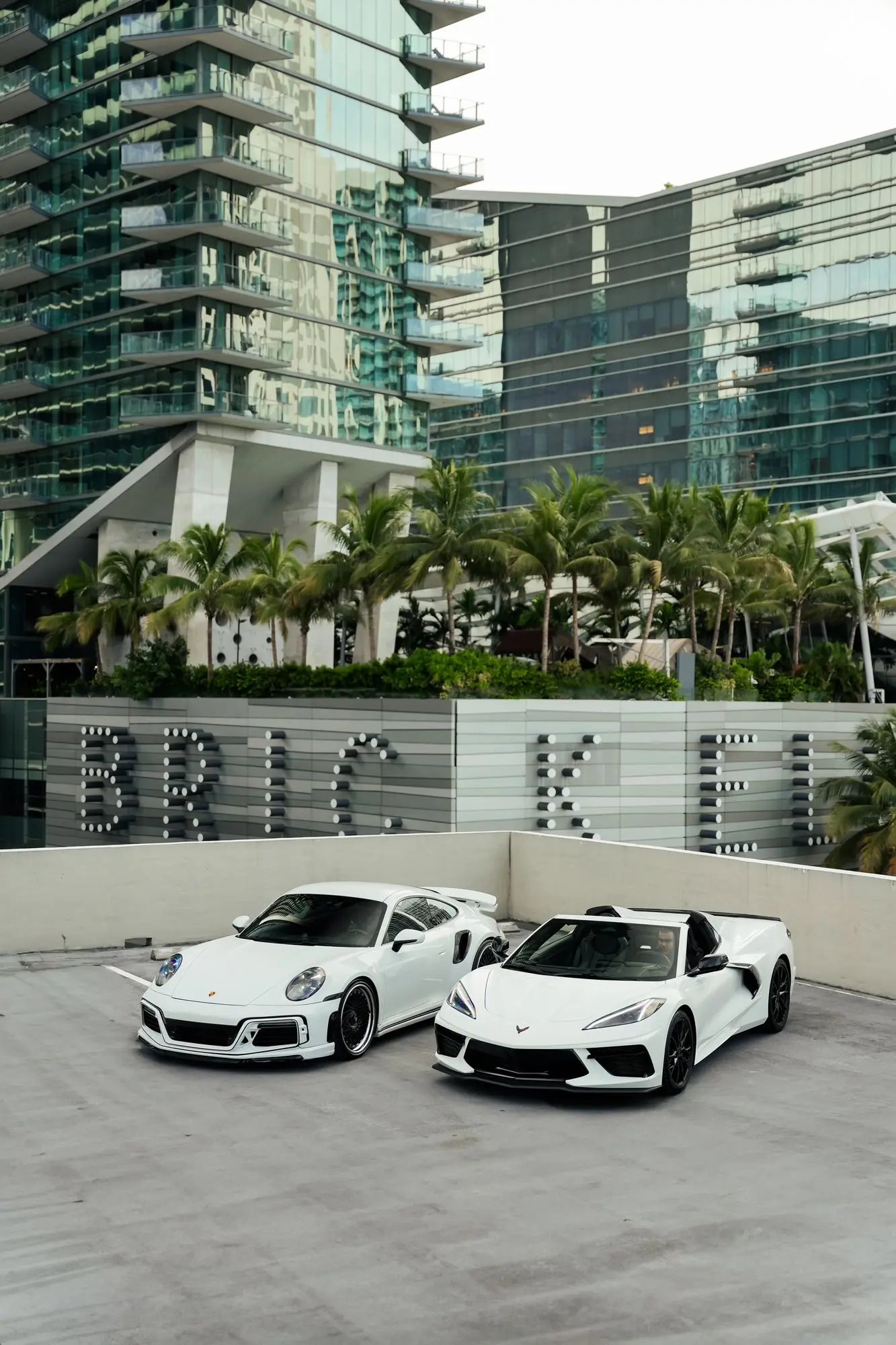 A Porsche 911 Turbo S and a Corvette C8 in Brickell